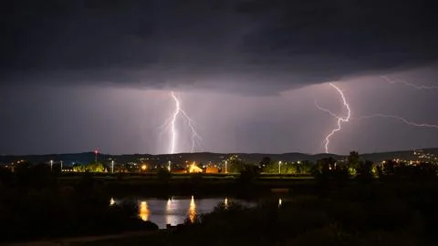 Multiple lightning during thunderstorm at night Stock Photos