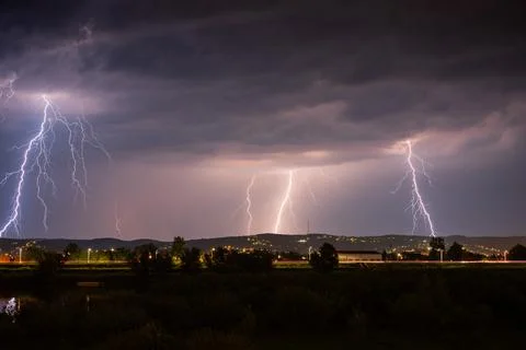 Multiple lightning during thunderstorm at night Stock Photos