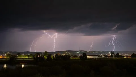 Multiple lightning during thunderstorm at night Stock Photos
