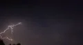 Multiple lightning forks flashing across dark night sky, thunderstorm with sound HD Footage