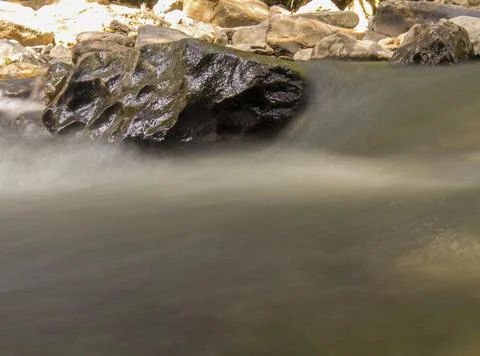 Multiple long exposure composite of the stream of the Moniquira river, a trop Stock Photos