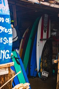 Multiple Longboards Stored in a Rustic Wooden Shack Stock Photos