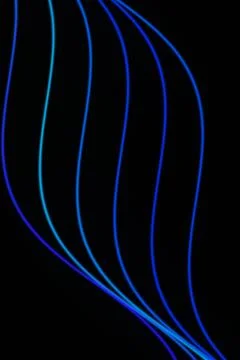 Multiple luminous blue and cyan curves bend vertically across a black field.. Stock Illustration