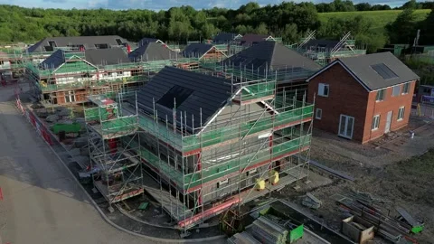 Multiple luxury new home property development aerial rising view over scaffold 库存影片 337958386