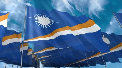Multiple Marshall Islands flags seamless looping waving on blue sky Stock Footage 343682835
