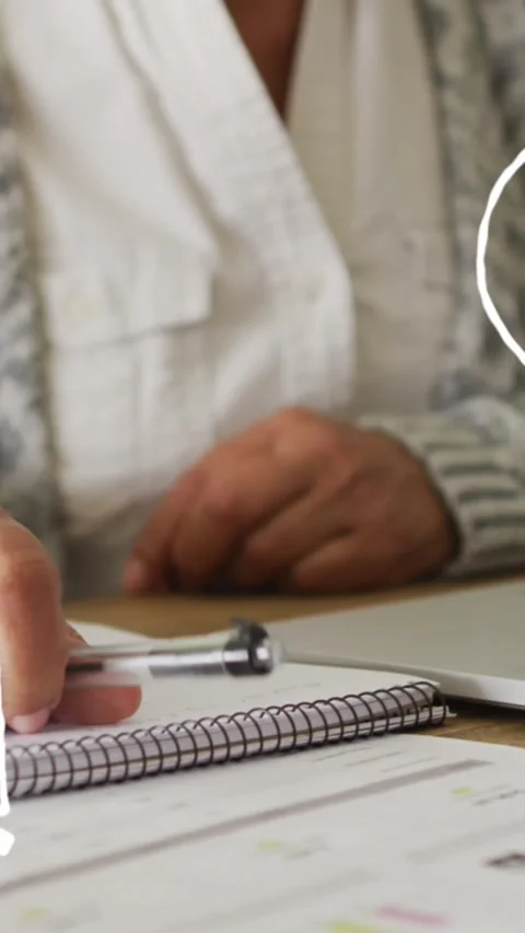 Multiple math concept icons against mid section of woman taking notes and using Stock Footage 319067076