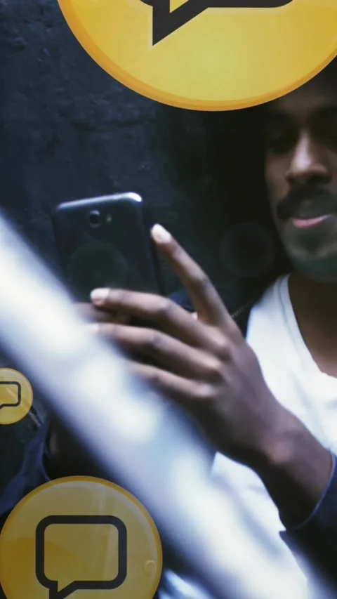 Multiple message icons floating against african american man using smartphone Stock Footage 342136347