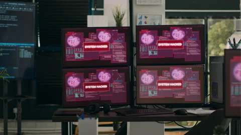 Multiple monitors with critical error message flashing on screens with hacking Stock Footage 227615426