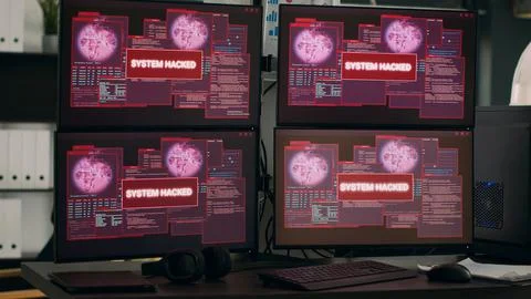 Multiple monitors displaying hacking warning alert after security breach Stock Photos