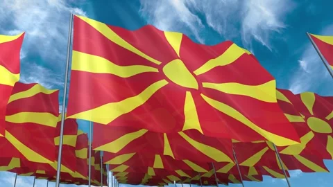 Multiple North Macedonia flags seamless looping waving on blue sky Stock Footage 343683682