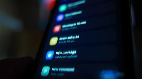 Multiple notifications flooding smartphone screen close-up Stock Footage 341078607