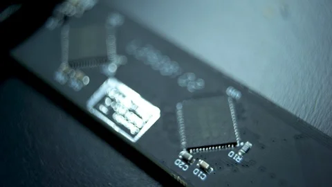 Multiple numbers and a small digital chip on a small holographic fan Stock Footage 96226272