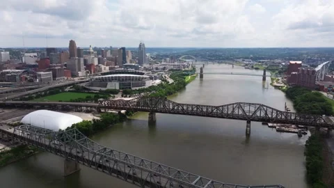 Multiple Ohio River bridges beside downtown Cincinnati skyline, aerial Stock Footage 345231447