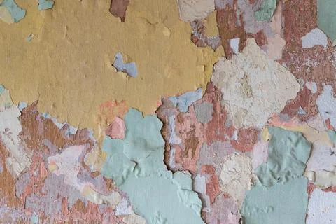 Multiple old paint layers in various colors on wall Stock Photos