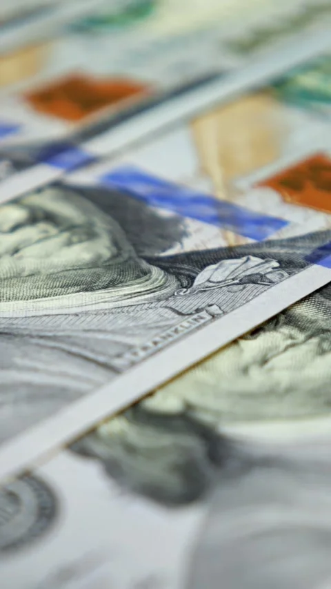 Multiple One Hundred Dollar Banknotes Rest Aligned In Orderly Pattern Under Stock Footage 347188805