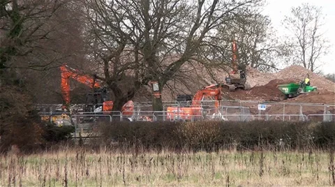 Multiple Orange Excavators Digging and a Dumper Truck Carrying Dirt Vídeos de archivo 35677549