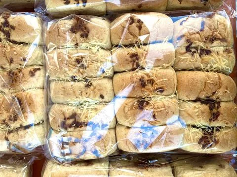 Multiple packs of soft wheat bread loaves Stock Photos