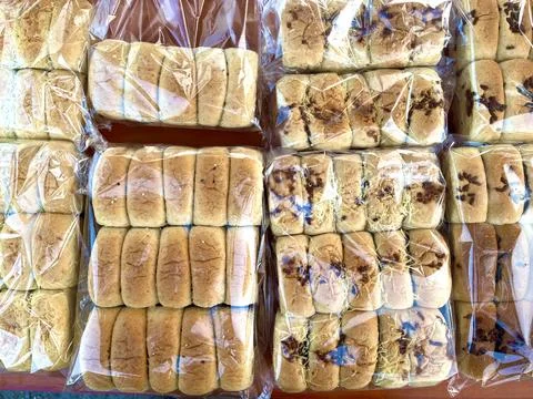 Multiple packs of soft wheat bread loaves Stock Photos