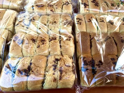Multiple packs of soft wheat bread loaves Stock Photos