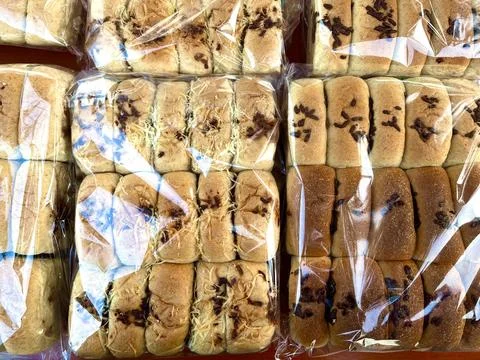 Multiple packs of soft wheat bread loaves Stock Photos