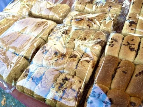 Multiple packs of soft wheat bread loaves Stock Photos