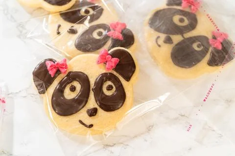 Multiple panda cookies arranged and wrapped individually Stock Photos