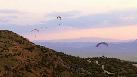 Multiple Paragliders Over Hills Stock Footage 310752092