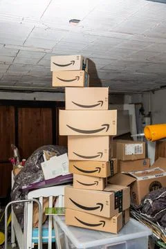 Multiple parcels from Amazon online internet retailer arranged in a tower in  Stock Photos
