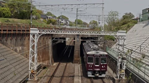 Multiple passenger trains passing over and under a bridge. Stock Footage 183658643