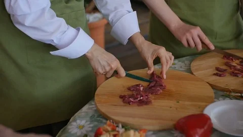 Multiple people slices Raw Meat On Wooden Board Stock Footage 75393812