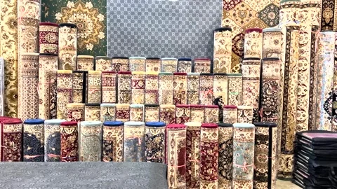 Multiple Persian carpets for sale at the store. Stock Footage 336655144
