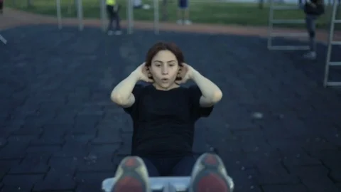Multiple plan clip shot of a young active female exercising in the park. Stock Footage 80946401
