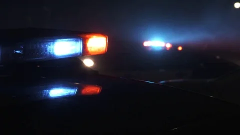 Multiple Police Cars Patrol At Night Stock Footage