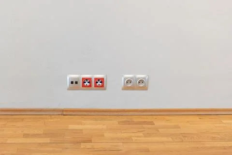 Multiple power sockets on a white grey wall modern contemporary interior de.. Foto stock