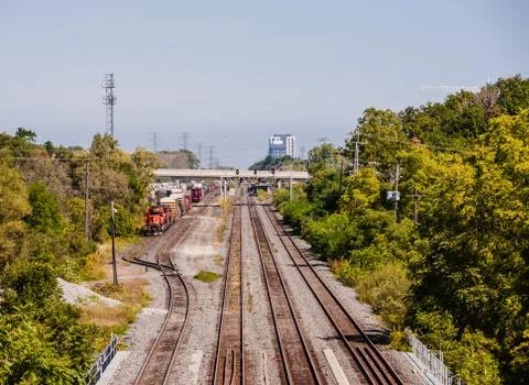 Multiple railroad tracks with train parked on siding in Burlington, Ontario, Foto stock