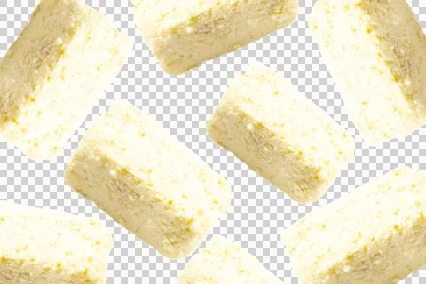 Multiple rectangular blocks of creamy white feta cheese arranged in a repea. Stock Photos