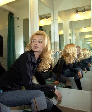 Multiple reflection of the girl in the mirrors. 写真素材