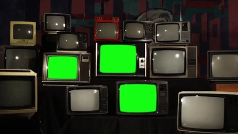Multiple Retro TVs turning on Green Screens. Zoom Out. Stock Footage 90738828