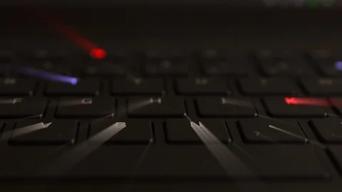 Multiple RGB colors on modern black laptop with iridescent beams Stock Footage 120752185