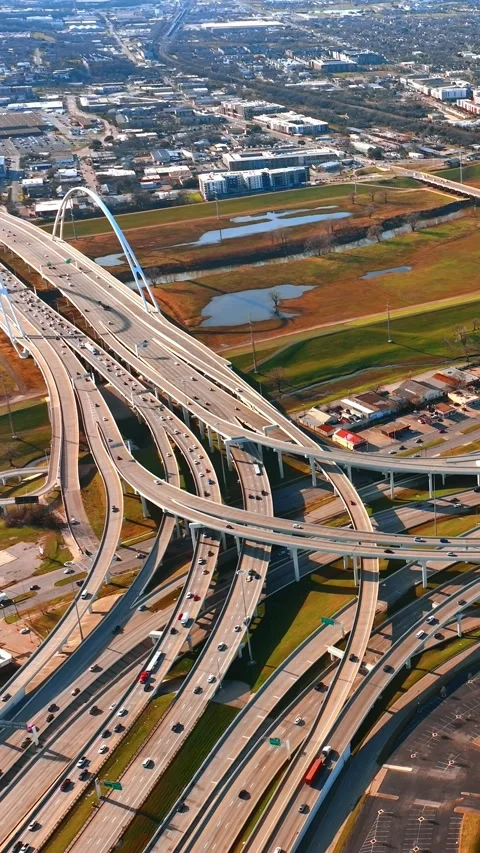 Multiple roads lead to the beautiful bridge in Dallas, Texas, USA. Sunny scenery Stock Footage 332345937
