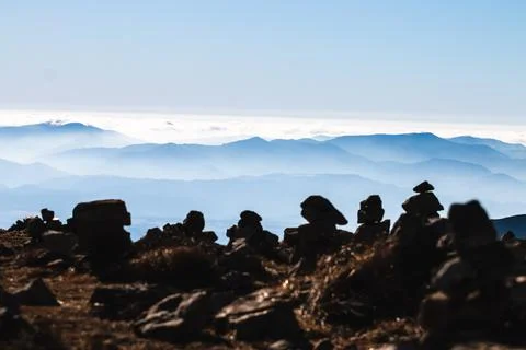 Multiple rock stacks on the mountain range of Tatra at sunrise. Poland. The W Stock Photos