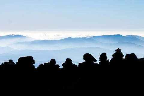 Multiple rock stacks on the mountain range of Tatra at sunrise. Poland. The W Stock Photos