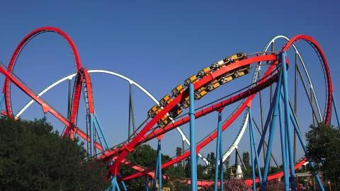 Multiple Roller Coasters At Theme Park Foto stock