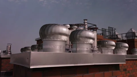 Multiple rooftop turbine ventilators on residential building Vídeo Stock 343450047