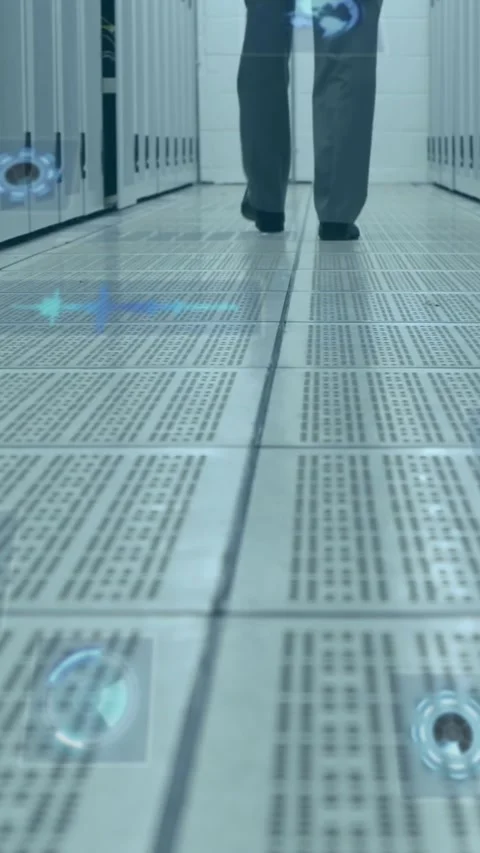 Multiple round scanners against mid section of man walking in computer server Stock Footage 342004126