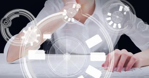 Multiple round scanners against mid section of woman using computer against Fotos de archivo
