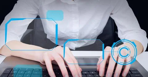 Multiple round scanners against mid section of woman using computer against Fotos de archivo