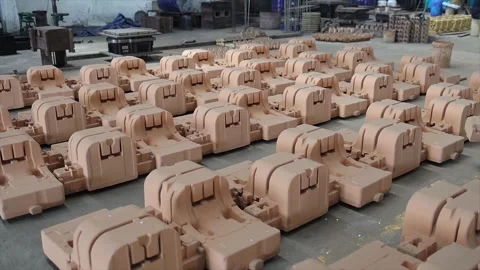 Multiple sand casting molds arranged systematically on a foundry floor Stock Footage 321746991