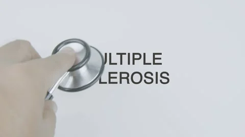 Multiple sclerosis word diagnosed with hand holding stethoscope on white Stock Footage 315397470