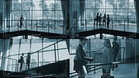 Multiple Screen CCTV of Business People Talking on Stairways in Spacious Office Stock Footage 274637197